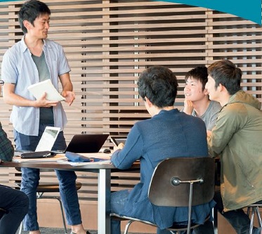 Man presenting in front of small group