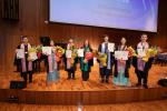 Ceremony performers with their awards and flowers